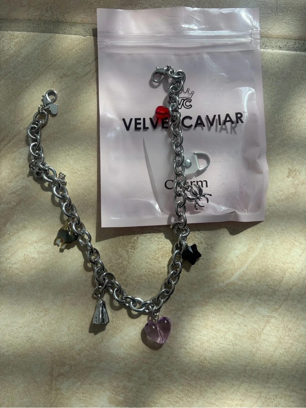 Velvet Caviar Silver Charm Bracelet with Red and Pink Accents